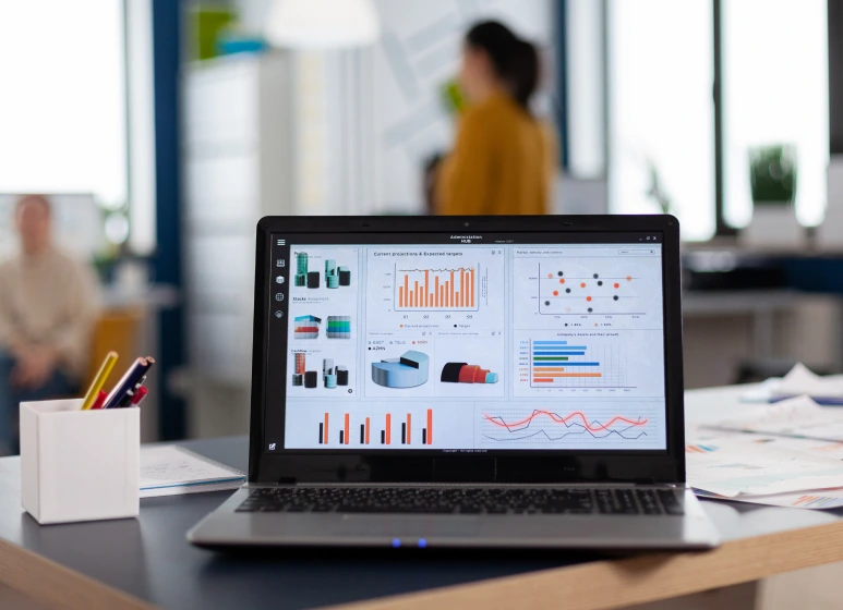 Laptop displaying charts and graphs, representing digital marketing analytics and strategies.
